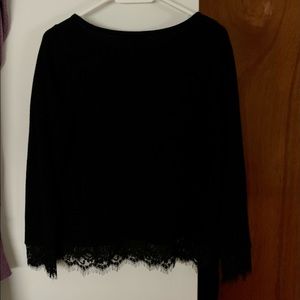 Black sweater.  Never worn. Size medium. Length 23”
